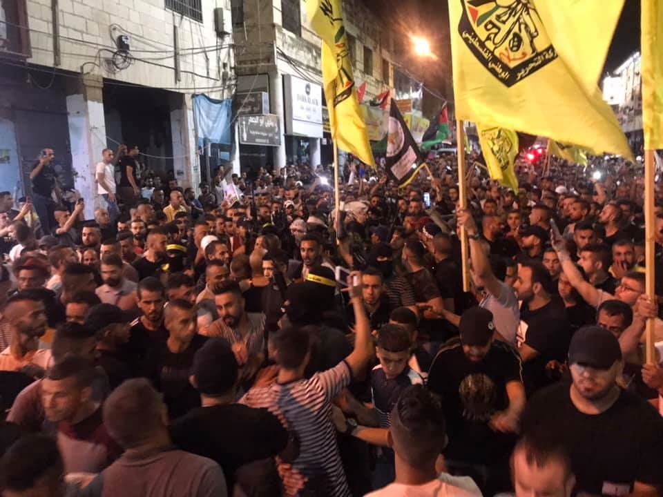 جانب من المسيرة. (عدسة: ثائر أبو بكر)