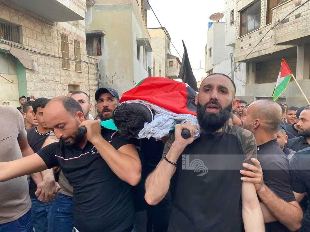 خلال تشييع جثمان الشهيد الطفل محمود سمودي في بلدة اليامون (عدسة: ثائر أبو بكر/ وفا)